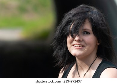 Punk Emo Girl, Young Adult With Black Hair And Eyeliner, Smiling, Looking At Camera, Outdoors, Horizontal, Close-up