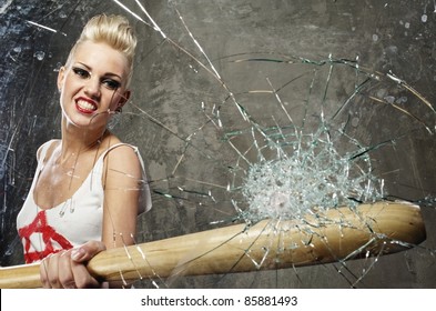 Punk Girl Breaking Glass With A Bat