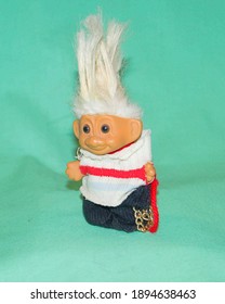 Punk rock troll doll with white hair and chains