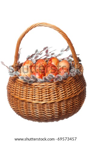 Punnet with co-loured easter eggs on white isolated background