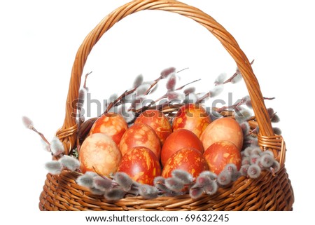 Punnet with co-loured easter eggs on white isolated background