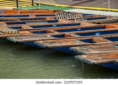 Punt flat bottom river wooden boats on river Cam waters in Cambridge