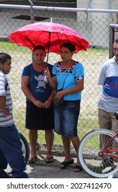 PUNTA GORDA, BELIZE - JULY 28, 2015 Women Waiting Under Shade At Court House During The Case Of The Santa Cruz 13 Accused Of False Imprisonment While Upholding Maya Land Rights