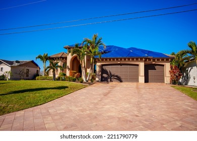 Punta Gorda, FL, USA - October 8, 2022: House In Punta Gorda Florida With Blue Tarp On Roof From Heavy Winds Hurricane Ian