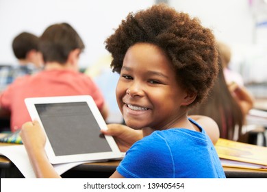 Pupil In Class Using Digital Tablet - Powered by Shutterstock