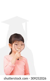 Pupil Looking Through Magnifying Glass Against Silhouette Of Graduate