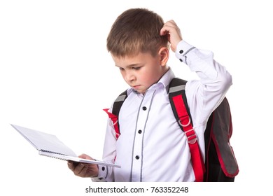 A pupil solving the task, holding exercise book. Portrait of intelligent pupil on the white background - Powered by Shutterstock - Get 15% off with code: PIKWIZARD15