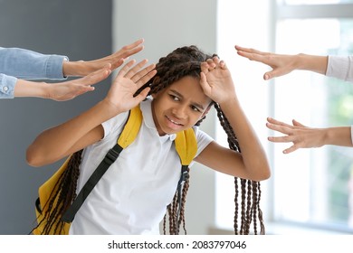 Pupils Bullying African-American Girl At School. Stop Racism