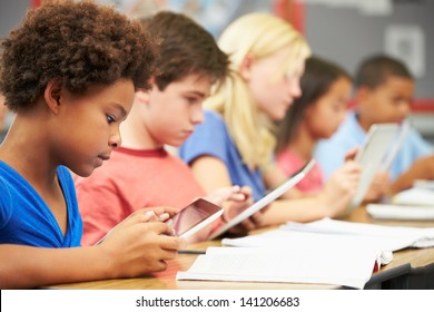 Pupils In Class Using Digital Tablet - Powered by Shutterstock