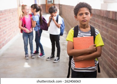 Pupils Friends Teasing A Pupil Alone In Elementary School