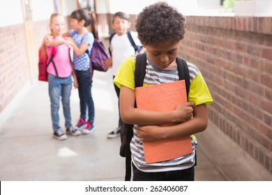 Pupils Friends Teasing A Pupil Alone In Elementary School