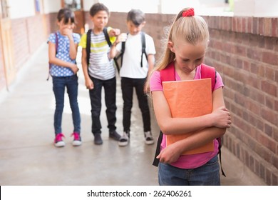 Pupils Friends Teasing A Pupil Alone In Elementary School