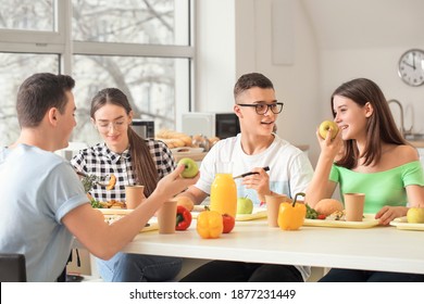 Pupils Having Lunch At School Canteen