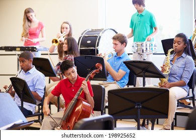 Pupils Playing Musical Instruments In School Orchestra