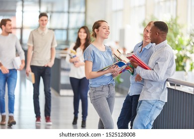 Pupils Or Students Making Small Talk In University