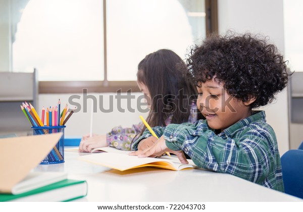 Pupils Studying Desks Classroom Two Little Stock Photo Edit Now
