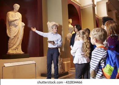 Pupils And Teacher On School Field Trip To Museum With Guide - Shutterstock ID 432834466