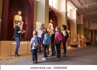 Pupils And Teacher On School Field Trip To Museum With Guide - Shutterstock ID 432834508