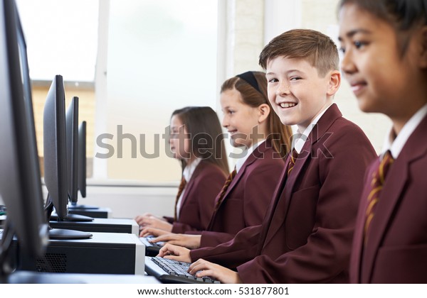 Pupils Wearing\
School Uniform In Computer Class\
