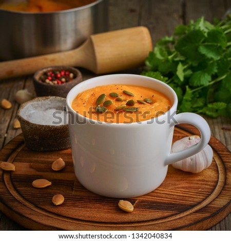 Similar – Foto Bild Kürbissuppe in weißer Schüssel und Zutaten auf Holztisch