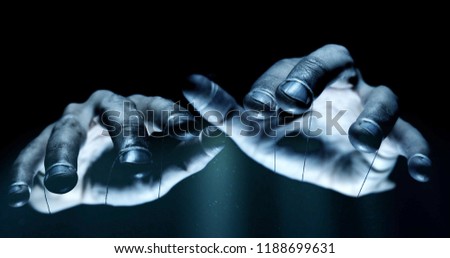 Puppet hands from leadership controlling our lives. Concept