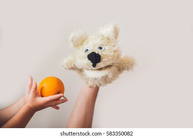 Puppet Show Dog On A Gray Background. Space For Text Or Replicas.