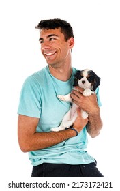 Puppy Cavalier King Charles And Man  In Front Of White Background