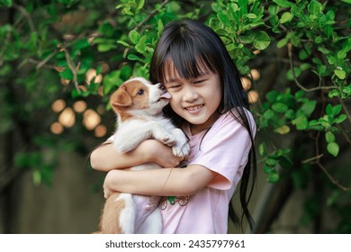 Puppy dog and happy kid at home. Relationship or friendship of a pet and human.	 - Powered by Shutterstock