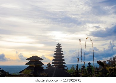 Pura Besakih temple complex, holiest of all Balinese Hindu temple. Summer landscape with religious buildings silhouette at sunset in Bali, Indonesia