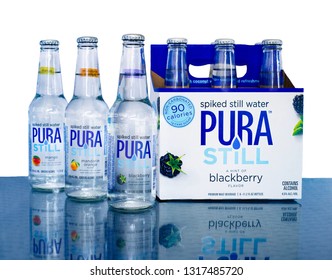 Pura Still Alcohol Made With Coconut Water And Low Calories Against A White Background