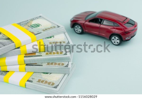 purchase auto dealership and rental car,\
car loan buying a new car concept. red car\
money