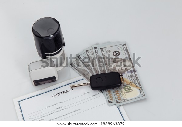 Purchase contract for a car with dollar banknotes,\
stamps and car keys