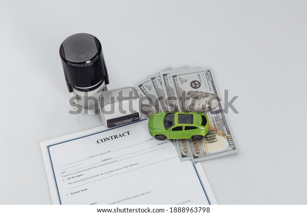 Purchase contract for a car with money, stamps and\
toy car