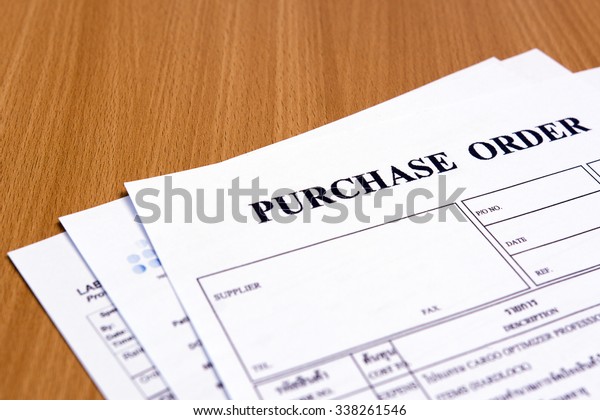 Purchase order form on wooden\
table