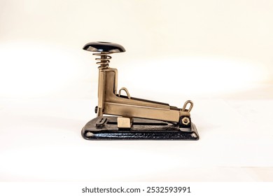 Purchased (consumer) vintage paper stapler close-up on a white background - Powered by Shutterstock