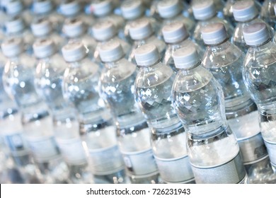 Pure Bottled Water In Small Handy Bottles For Sale On Store Shelfs. Close Up Horizontal Composition With Shallow Depth Of Field.