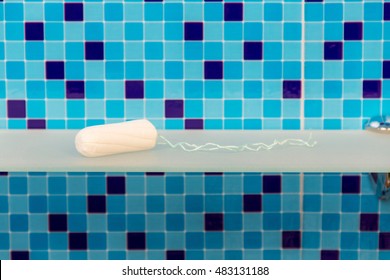 Pure Cotton Tampon On A Shelf In The Bathroom. Background.