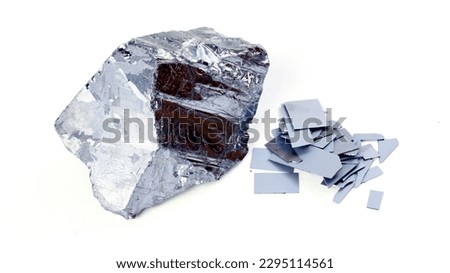 Pure elemental silicon and pieces of silicon wafer isolated white background