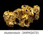 Pure gold from the mine on a black background. Gold ore as finance and business concept.