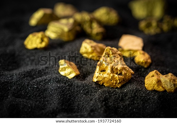Pure gold from the mine that was unearthed was\
placed on the black sand.
