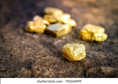 The Pure Gold Ore Found In The Mine On A Stone Floor