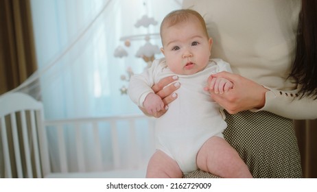 The Pure Love Mother And Baby Girl Laying Down On The Bed And Speeding The Time Together Mother Carefully Kissing The Baby