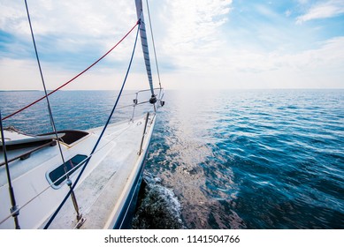 Pure morning light over he Baltic sea. A view from the sailboat's deck to the bow, Estonia