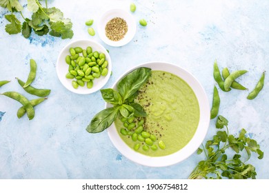 Pureed Edamame Soup Served In A Bowl With Fresh Herbs Seasoning, Top Down View