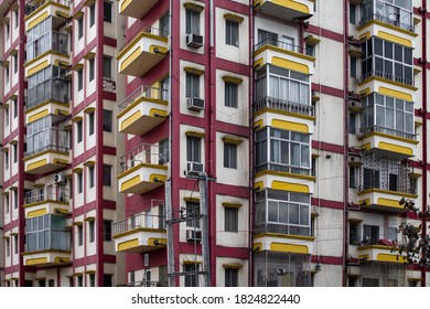 Puri, India - February 3, 2020: Street View Of A Pink And Yellow Residential Apartment Building With Balconies On February 3, 2020 In Puri, India