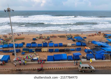 Puri Sea Beach Aerial View With Beach Stalls, Tourists And Vehicle Parked In Adjacent Road At Odisha India Dated 11th May 2022.