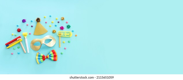 Purim celebration concept (jewish carnival holiday) over blue  background