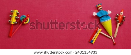 Purim Festival objects (masquerade mask) on pink background.  Top view. Banner