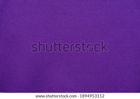 Purple background made of textile material. Fabric with natural texture. Fabric isolated background.