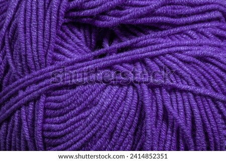 Purple background, string yarn structure close up